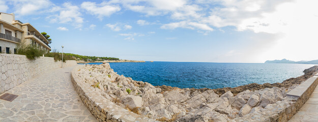 Coastal walkway at Cala Ratjada, Mallorca island, spain, with rocky coast (Panorama)