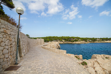 Coastal walkway at Cala Ratjada, Mallorca island, spain, with rocky coast