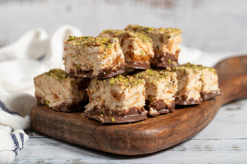 Pistachio and chocolate chip cookies. Fresh pistachio cookies on wooden background. Close up