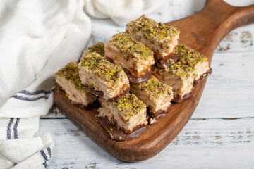 Pistachio and chocolate chip cookies. Fresh pistachio cookies on wooden background