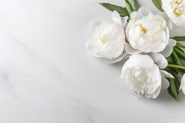 Obraz na płótnie Canvas White peony flowers on a gray table Space for emotive text Close up shot