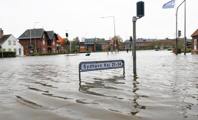 Flooded streets and houses in a Danish city under violent autumn storm surge