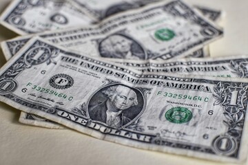 A pile of one US dollar bills.  Minimum funds.