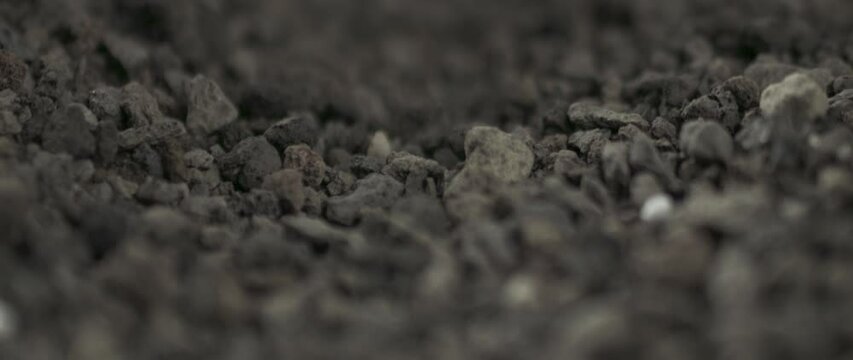 soil slowmotion moving falling and bouncing with dust and particles