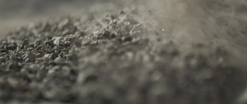 soil slowmotion moving falling and bouncing with dust and particles