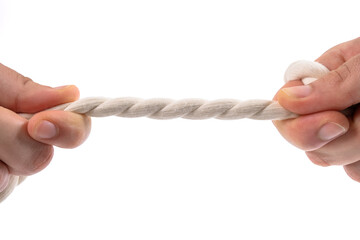 Two people pulling a rope in opposite direction isolated on white background. Male and female hands pulling white thread. Competition, conflict and arguing concept. Tug war, copy space