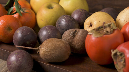 Autumn fruits on rustic table