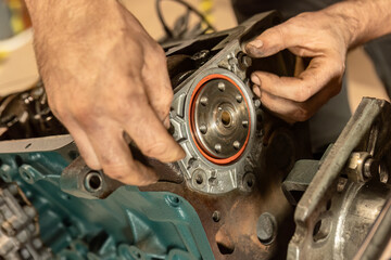 Mechanic's Hands Restoring Vintage Engine