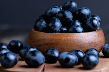 Unwashed blue grapes in the dust