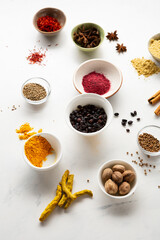 spice collection in bowl on light surface cooking concept pepper cumin nutmeg