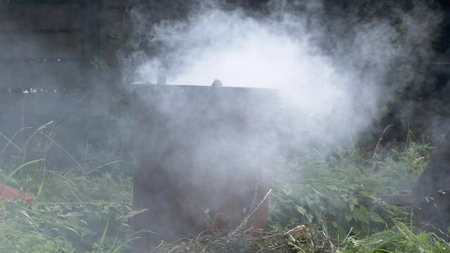 Garden and house garbage burning in a bin incinerator