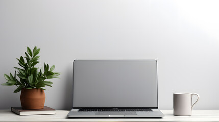 Laptop computer with blank screen on desk in modern home or office interior mock up