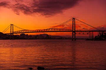 Hercilio luz cable stayed bridge and sunset with bright sky in Florianopolis