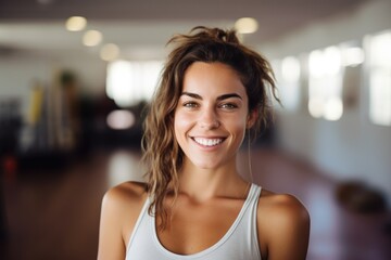 portrait of a happy and smiling yoga teacher in yoga retreat on island. Sunny day, natural colors.