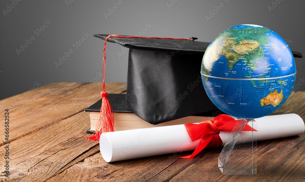 Canvas Prints Graduation cap with on wooden desk in classroom