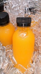 Orange juice bottles on the ice box
