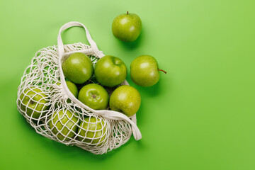 Mesh bag with fresh green apples