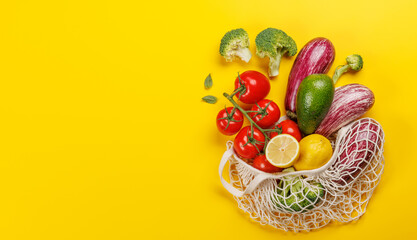 Mesh bag filled with a variety of vegetables