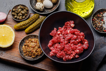 Cooking savory beef tartare and brown bread toasts