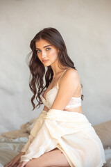 Beautiful woman posing in bed