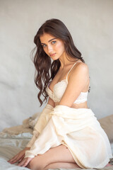 Beautiful woman posing in bed