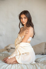 Fototapeta premium Beautiful woman posing in bed