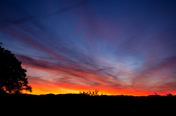 Sunrise against the background of sky and clouds