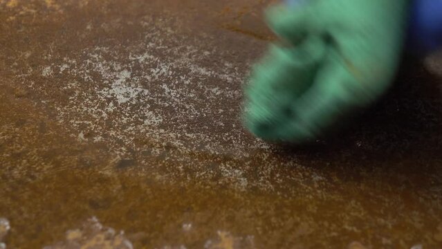 Cleaning surface of sheet of metal from a layer of rust with citric acid solution  for reuse, primary rust removal