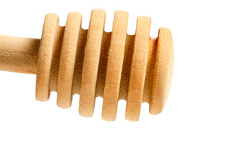Wooden honey spoon in the form of a beehive white background.