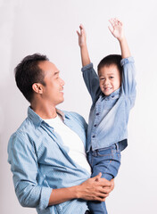 happy asian father holding adorable little son. Cute boy with dad playing. happy family, father day