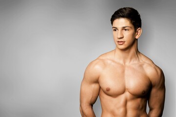 Fototapeta premium portrait of a handsome happy young man studio shot.