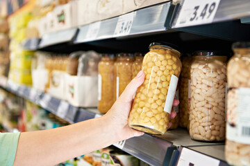 Chickpea can in hand in shop
