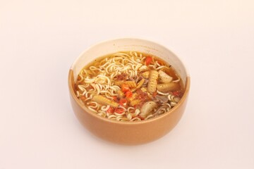 Egg noodle soup or indomie instant noodle soup with egg served on a bowl. Isolated on white background.