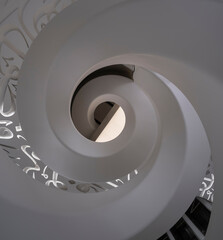 Spiral staircase shot from the bottom, looking up. Museum of the future in Dubai, UAE.