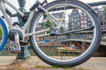 Amsterdam Canal Quay and Bicycle Wheel