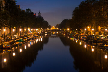 Amsterdam Night Canal With Parked Cars and Boats
