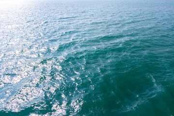 Blue sea surface with waves