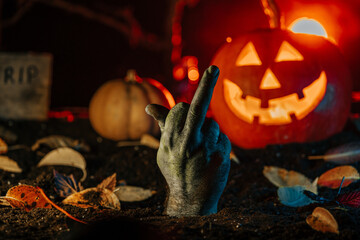 Zombie hand with middle finger - gesture of fuck. Negative from grave, halloween