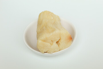 Tapai is fermentation of cassava with yeast. Indonesian snack. Isolated on white background