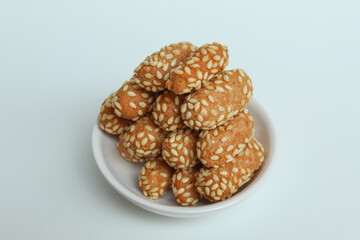 Onde-onde ceplus, snack from Indonesia. Flour dough covered by sesame seeds then fried. Isolated in white background
