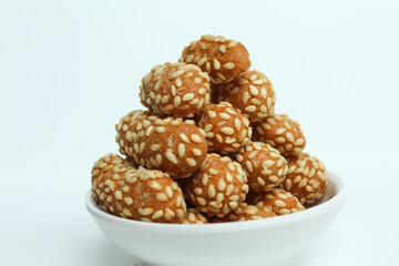 Onde-onde ceplus, snack from Indonesia. Flour dough covered by sesame seeds then fried. Isolated in white background