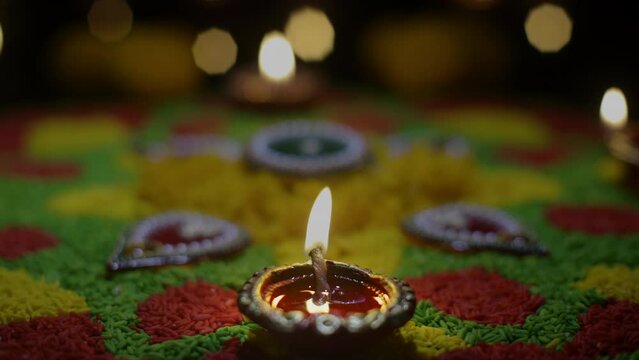 Clay diya lamps lit during diwali celebration, Diwali, or Deepavali, is India's biggest and most important holiday.