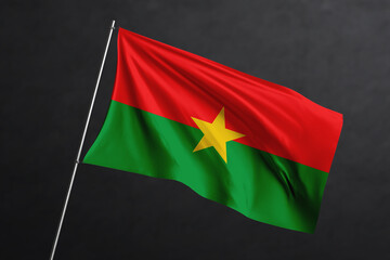 3D Waving flag design. Burkina Faso National flag on black background.