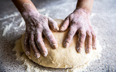 Preparation doughs. Preparation doughs women's hands. Making dough by male hands at bakery. Food concept. Hands dough. Female hands making dough for pizza.