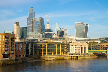 Fototapeta na wymiar Millennium Bridge and City of London urban skyline in London, the UK
