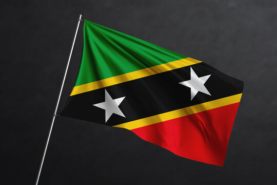 3D Waving flag design. Saint Kitts and Nevis National flag on black background.