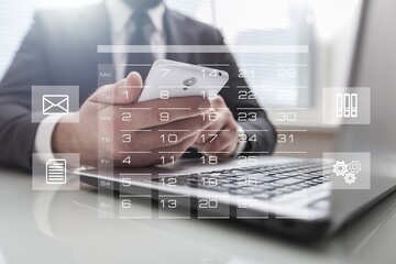 Reminder calendar and Businessman hands on keyboard