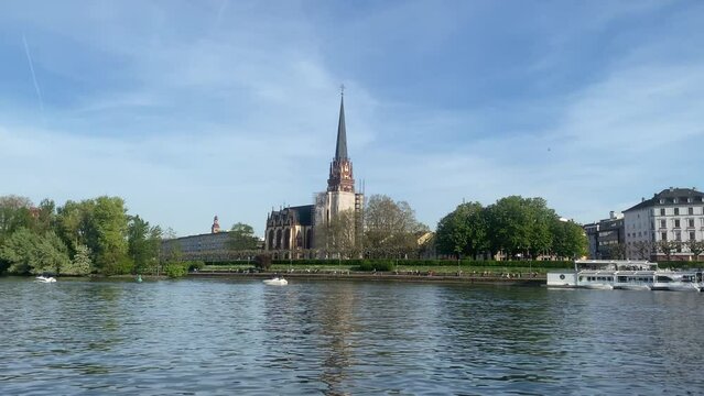 Dreikonigskirche or Three King's Church in Frankfurt and Eiserner Steg Bridge on the banks of River Main, Germany