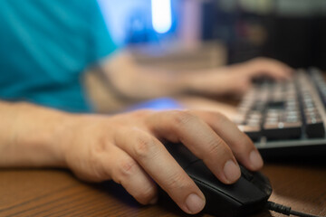 Close-up On Gamer's Hands on a keyboard, Actively Pushing Buttons, Playing MMO Games Online....