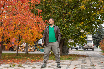 Fototapeta premium Portrait of a middle-aged man in a leather jacket